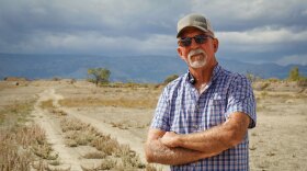 Carbon County farmer Kevin Cotner stands next to a bare field south of Price, Sept. 30, 2025. He’s one of around a dozen Utah farmers who are leaving some of their land unplanted and unirrigated this year as part of a state effort to leave more water for the Colorado River.