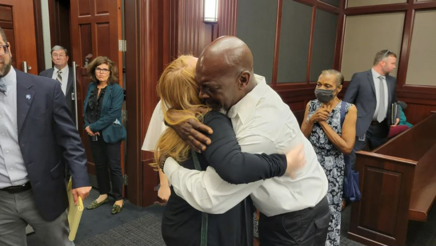 Edward Clayton Taylor and Stephanie McIntyre Love embrace at Friday's court proceeding vacating Taylor's 1987 rape conviction. Love was a 4-year-old sexual assault victim who had mistakenly identified Taylor as her assailant.