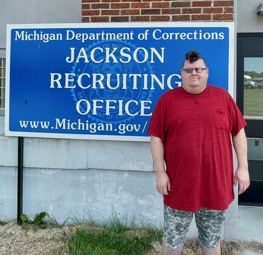 Corrections Department recruit Taylor Burgett poses outside the facility where he just passed a physical fitness test. 