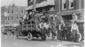 National Guardsmen and wounded residents are shown during the 1921 Tulsa Race Massacre. The wounded were being taken to the Brady theater.