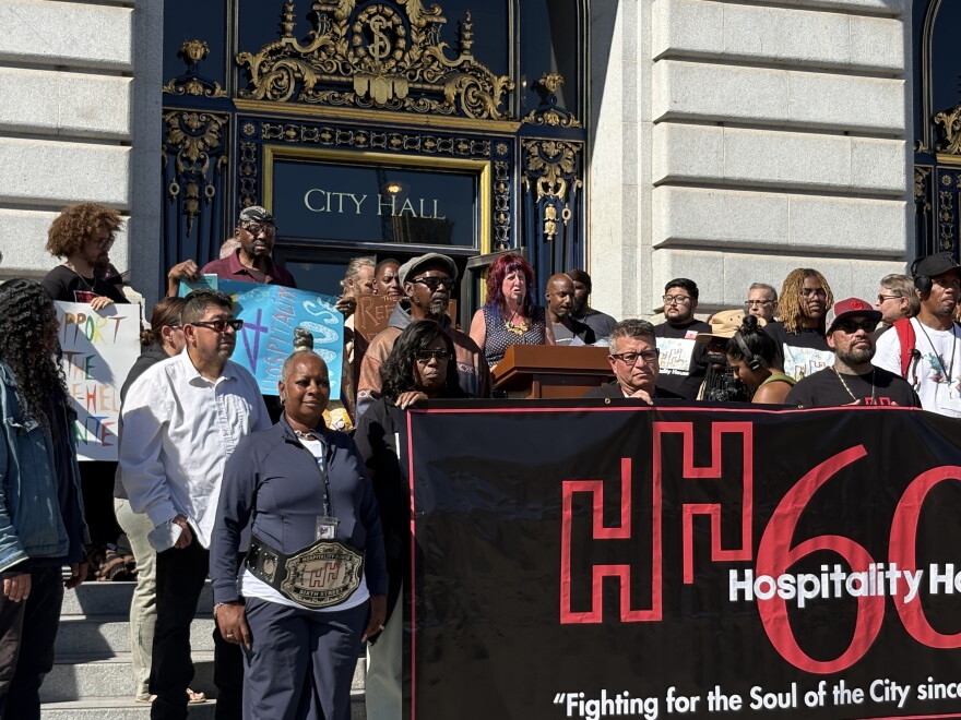 Folks rally in front of San Francisco's City Hall to protest the closure of Hospitality House's Sixth Street Self-Help Center