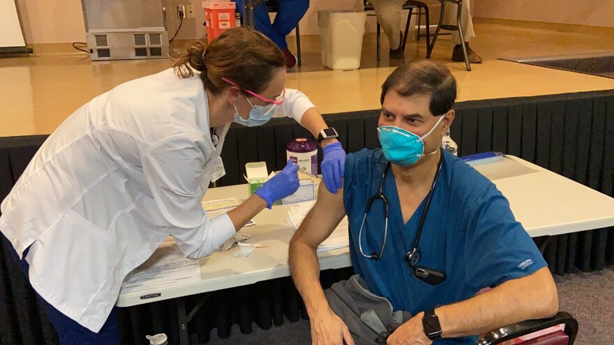 A shot of the Pfizer COVID-19 vaccine being administered Thursday morning is pictured at Memorial Hospital in Jacksonville.