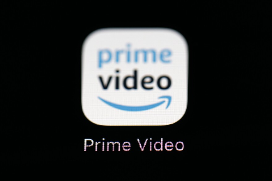 FILE - Amazon's Prime Video streaming app on an iPad is seen in Baltimore on March 19, 2018. Amazon says that it will now start charging $2.99 per month in order for users in the U.S. to watch Prime Video ad free. (AP Photo/Patrick Semansky, File)