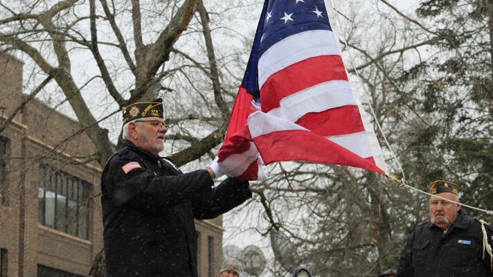 Gary Guggenberger from VFW Post 1260 helps fold a retired flag at Bemidji State University on Thursday, Nov. 9, 2023.