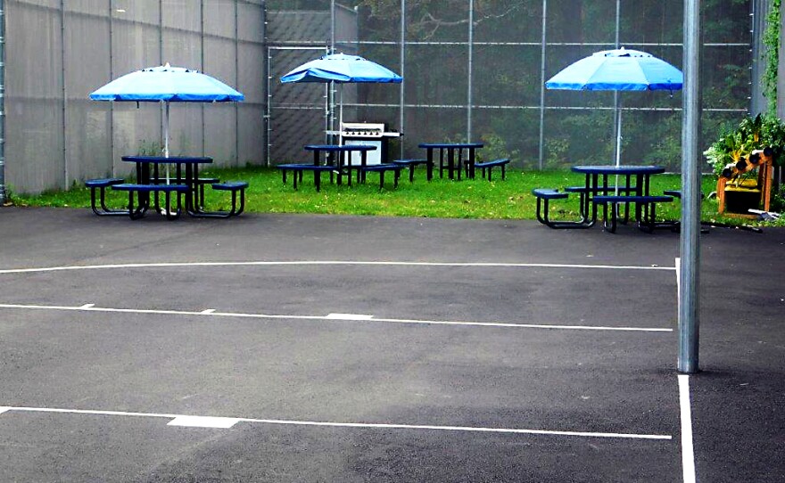 The Regions Program for Boys in Hamden has this basketball court, which is surrounded by a security fence.