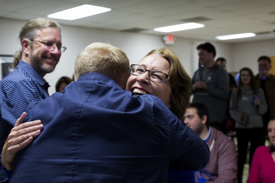 Democrat Trish Gunby is congratulated by her son, Kyle Gunby, who worked on her campaign, after winning a traditionally Republican Missouri House seat in the 99th District.  Nov. 5, 2019