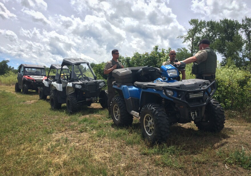 Three Jackson County Sheriff's deputies visit camps along the Bear Creek Greenway outside Medford on a weekly basis as part of their effort to address homelessness.