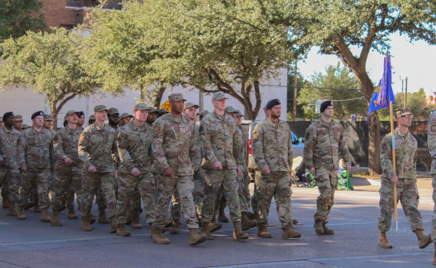 Active duty Dyess personnel march down Cypress Street.