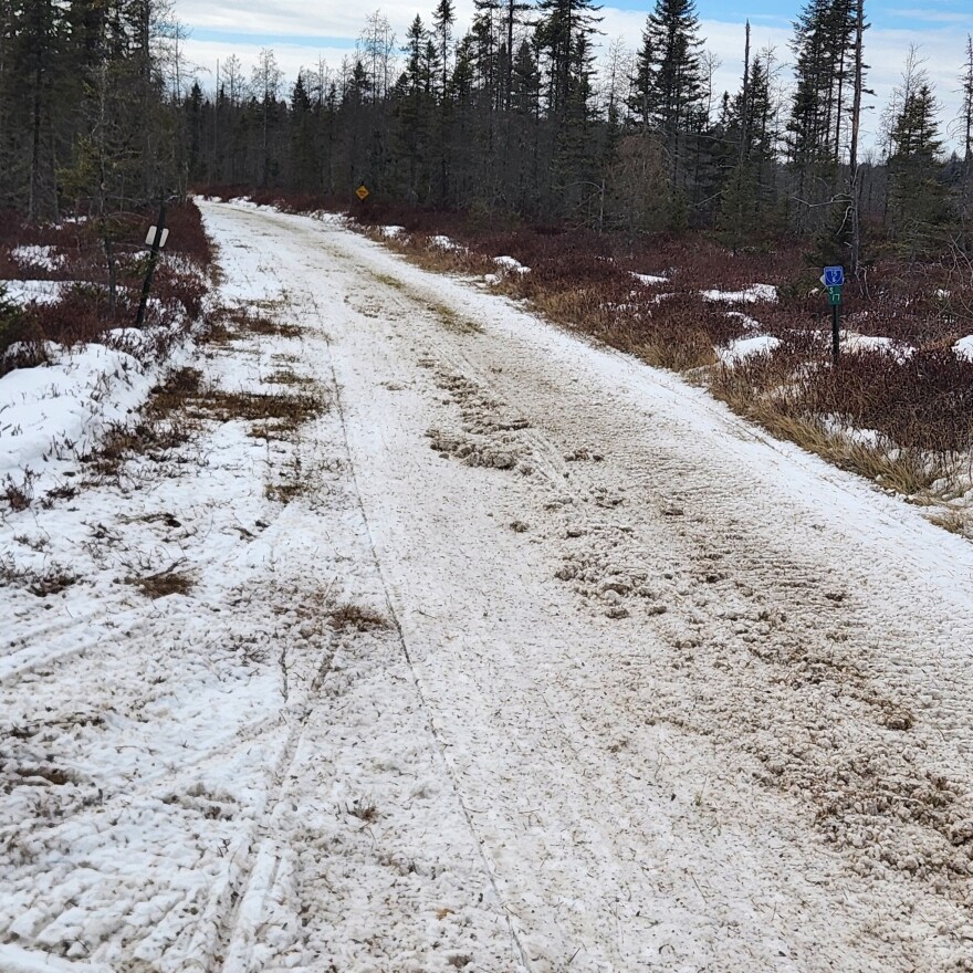 Snowmobile trail deteriorated by warm weather