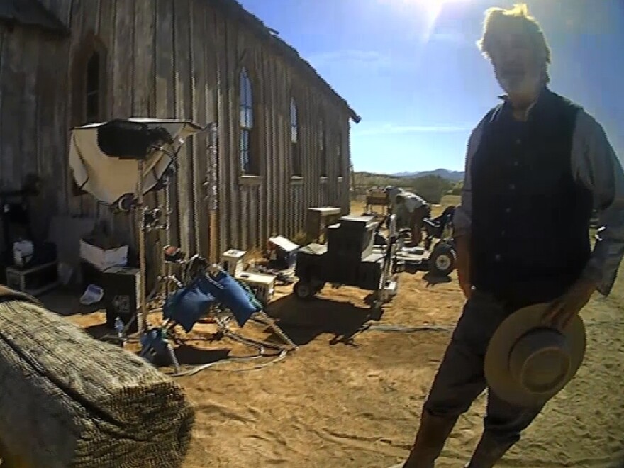 In this 2022 image from video released by the Santa Fe County Sheriff's Office, Alec Baldwin stands in costume and speaks with investigators following a fatal shooting on a movie set in Santa Fe, N.M.