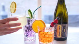 A woman takes a non-alcoholic Limello Spritz from the table, while there are the other non-alcoholic cocktails Gin Tonic, Aperol Spritz and a zero-percent sparkling wine. (Annette Riedl/Picture Alliance via Getty Images)
