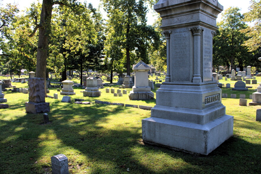 Many monuments mark the landscape of a cemetery. 
