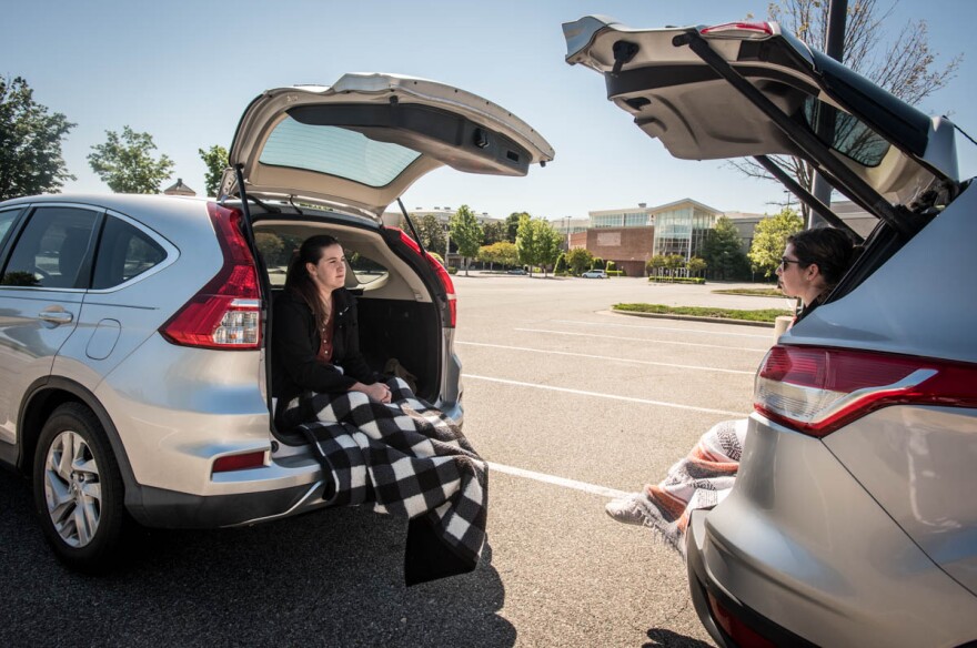 Grace Knaus, left, of Apex, NC, visits with Polly Payne of Greensboro, NC, on Saturday in the parking lot of Southpoint Mall in Durham, NC