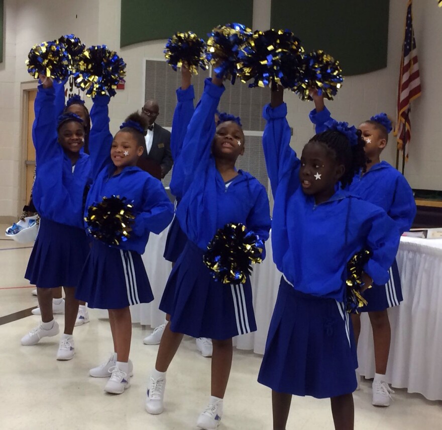 Students from Jefferson elementary schools cheer for the Normandy school board Thursday night, Jan. 28, 2016