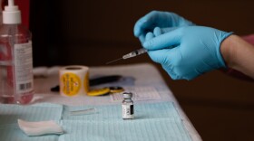 a small vial sits on a table
