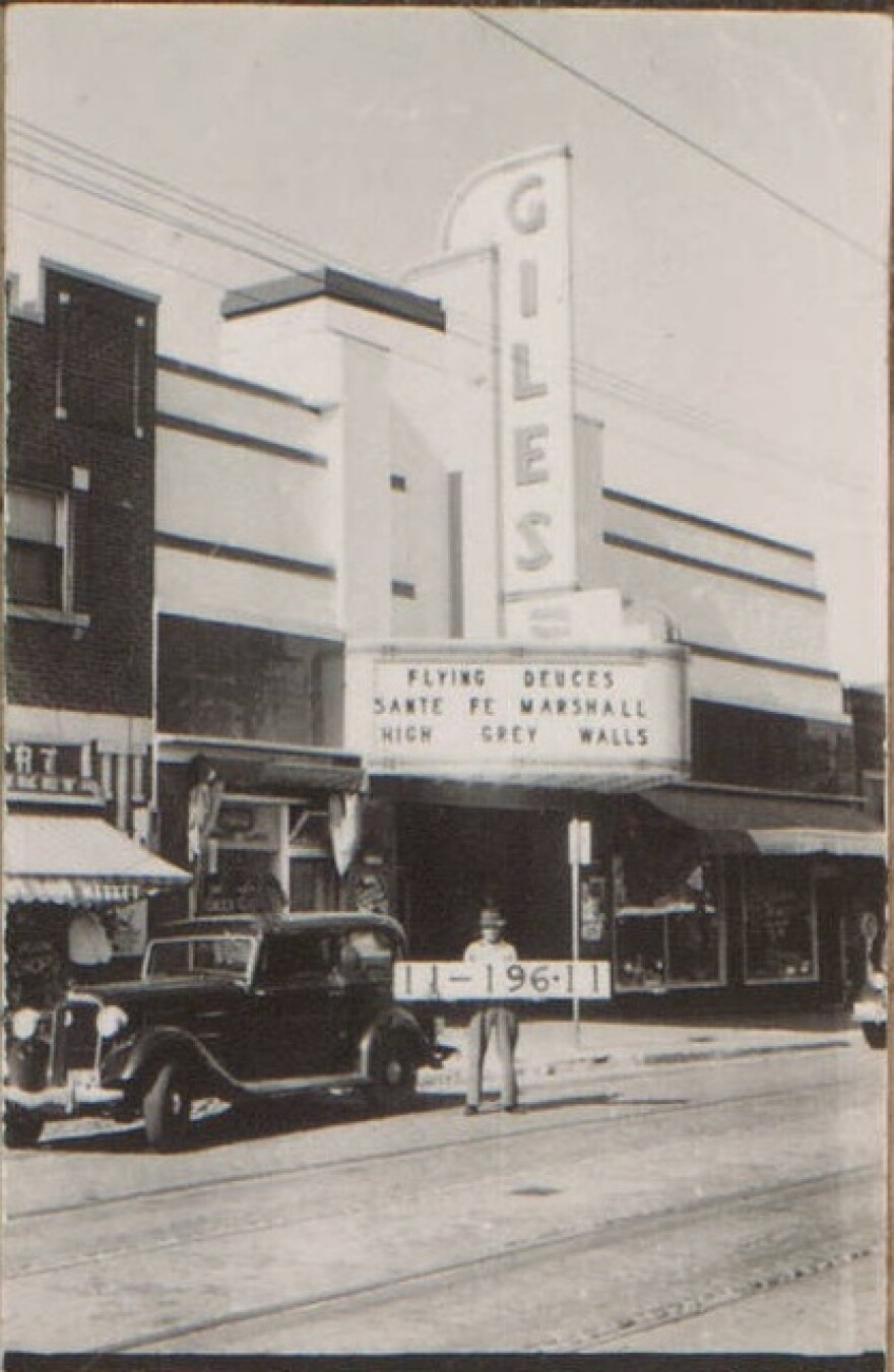 The Giles Theatre, a movie theater that once made up the eastern side of the building at 39th and Bell streets. The movie titles displayed on the marquee suggest the photo was taken in 1939.