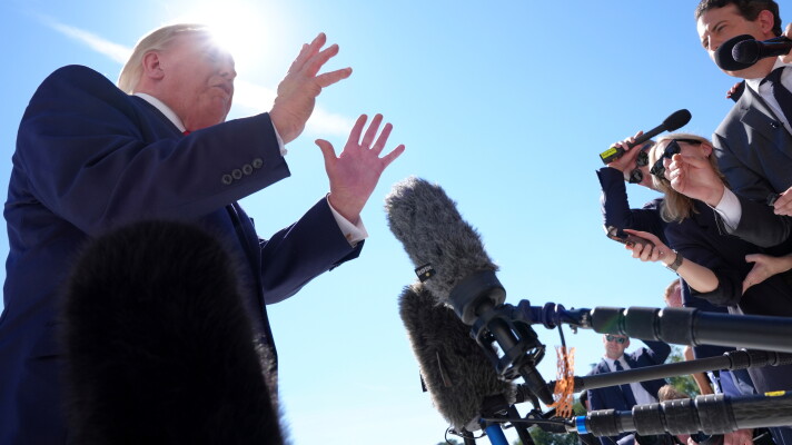 President Donald Trump speaks with reporters before boarding Marine One on the South Lawn of the White House, Thursday Oct. 1, 2026, in Washington. (AP Photo/Jacquelyn Martin)