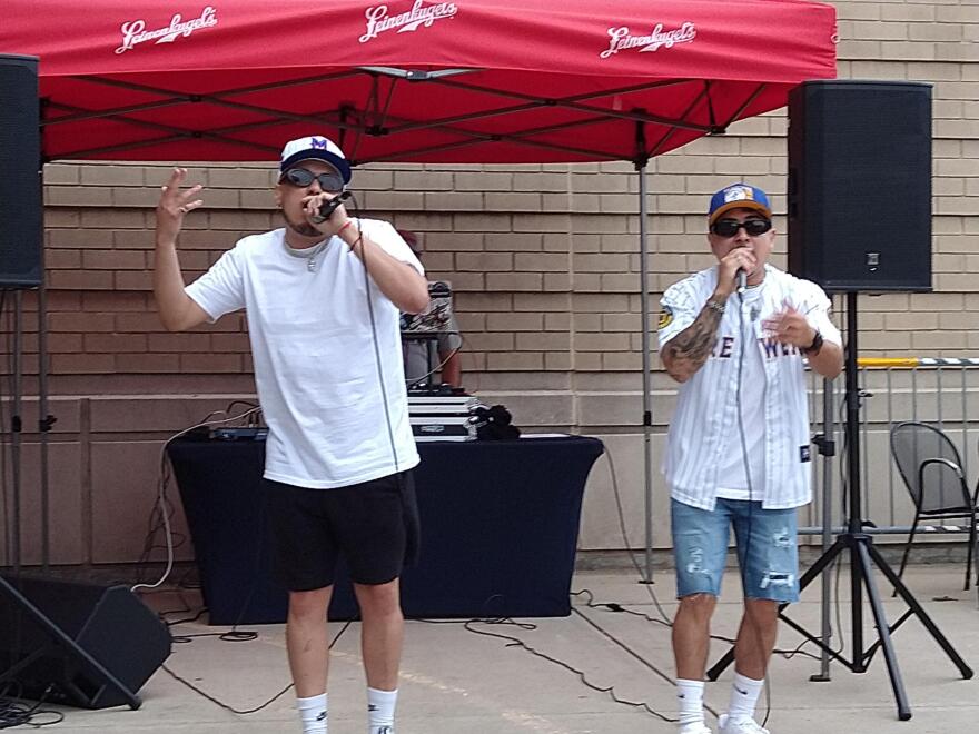 Adonys "Nony" Bruno (left) and Jose "Gego" Chavez perform before the recent Cerveceros Night game,