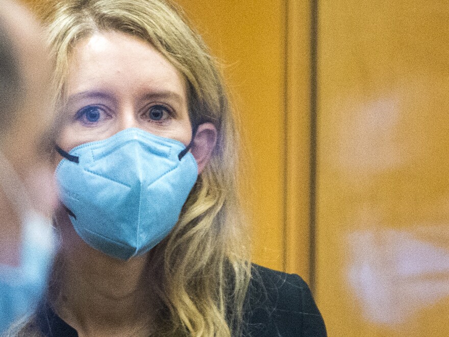 Elizabeth Holmes walks into federal court in San Jose, Calif., Thursday. The lawyers for the opposing sides in the trial of the former Theranos CEO wrapped up their closing arguments Friday, allowing the jury to begin their deliberations over criminal charges accusing Holmes of turning her blood-testing startup into a massive scam.