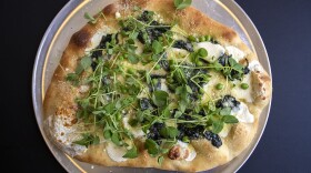 Chef Kathy Gunst's fresh pea and spinach pizza with pea sprouts. (Jesse Costa/WBUR)