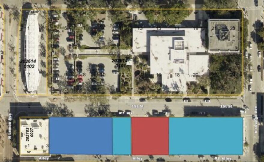 Two parcels purchased by the City of Sarasota (light blue) on First Street across from City Hall are slated for affordable housing. The city already owned a parking lot (dark blue) but was unable to acquire the middle parcel and an office building owned by 1st Street Credit Union (red).