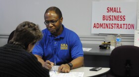 Thompkinsville, KY, March 2, 2008 - Small Business Administration(SBA) Specialist Grady Billingslea explains services available through SBA for residents impacted by the storms and tornado which struck Monroe County in early February. FEMA and SBA are partners in helping people with disaster recovery. George Armstrong/FEMA