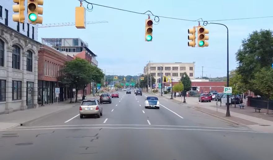  A photograph of Kalamazoo Avenue at an intersection with green lights. McDonalds is in the distance.