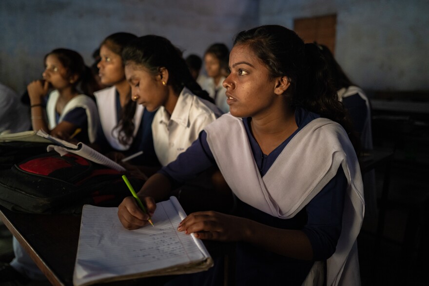 Anjali attends a class inside Karkend High School in July 2022, in the city of Dhanbad, near Jharia.