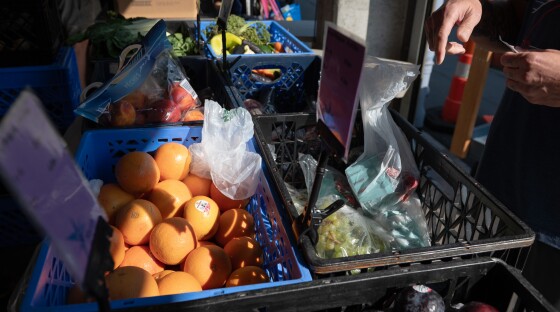 Baskets of fruit and vegetables are handed out at North Helpline's Lake City Food Bank, where demand for services has grown in recent months.