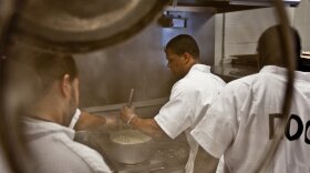 Inmate Calvin Hodge, in the second week of a five-week rotation as head chef, stirs gravy in preparation for lunch at the Fife and Drum Restaurant at the Northeastern Correctional Center in Concord, Mass., Jan. 26.  