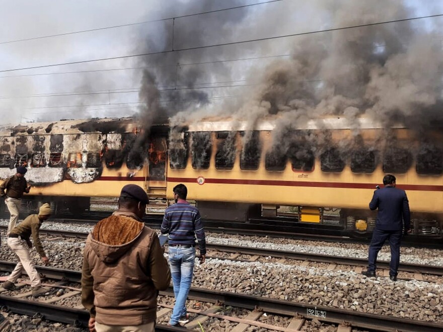 A mob set this train car afire as they protested railway jobs that set increasingly demanding requirements, shutting out many applicants. What the media called a "job riot" took place in Gaya in the northeast Indian state of Bihar on Jan. 26.