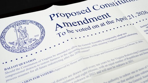 A poster on the Virginia redistricting referendum is seen during voting at Mason Square, Tuesday, April 21, 2026, in Alexandria, Va.