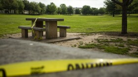 Caution tape is placed over tables at Mueller Lake Park. The city has closed park amenities in an effort to slow the spread of the coronavirus.