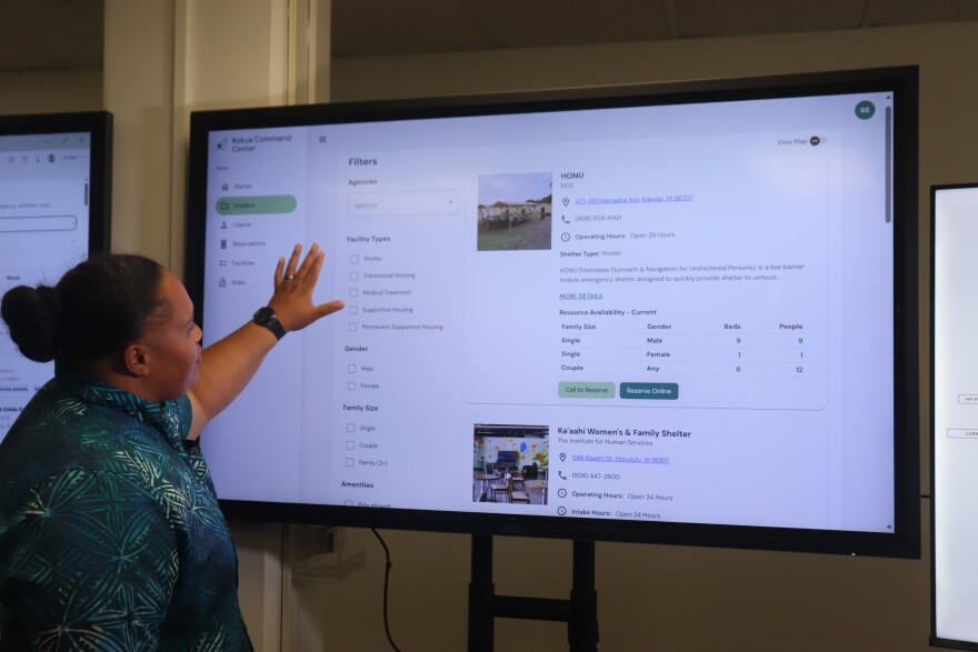 A DCS staff member demonstrates how to use the new platform.