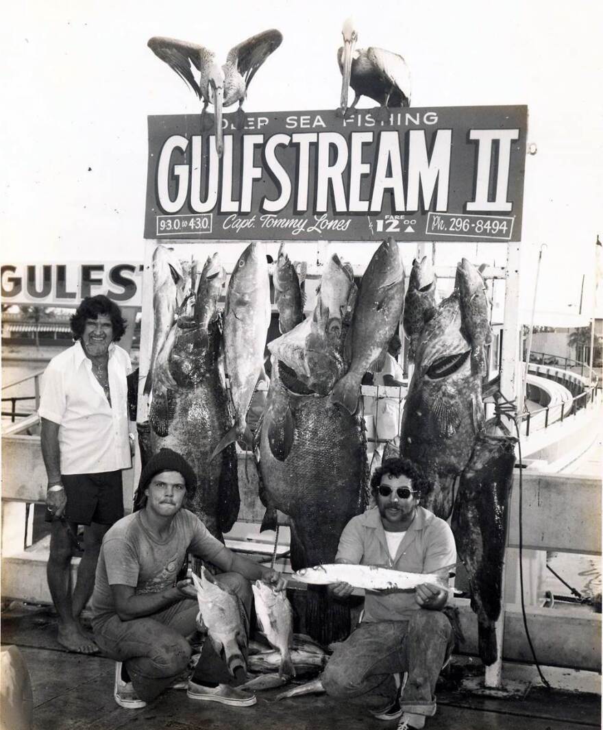 Even prize fish are smaller than the people who caught them in this photo from sometime between 1965 and 1979.