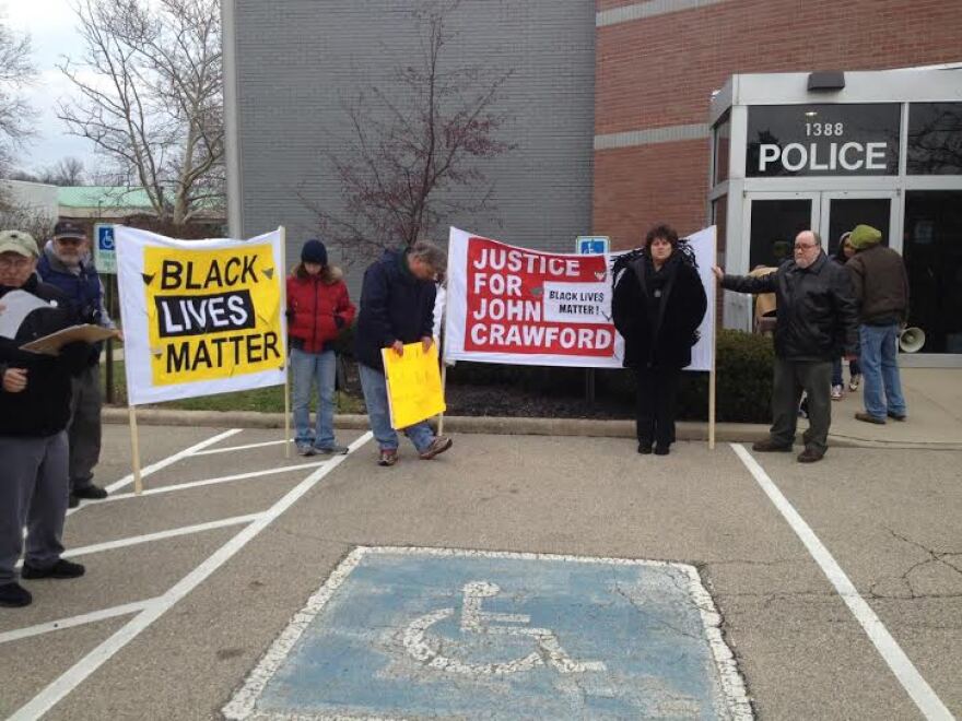 Protestors demonstrate in front of Beavercreek Police station following the death of John Crawford III inside a Beavercreek Walmart in 2014.