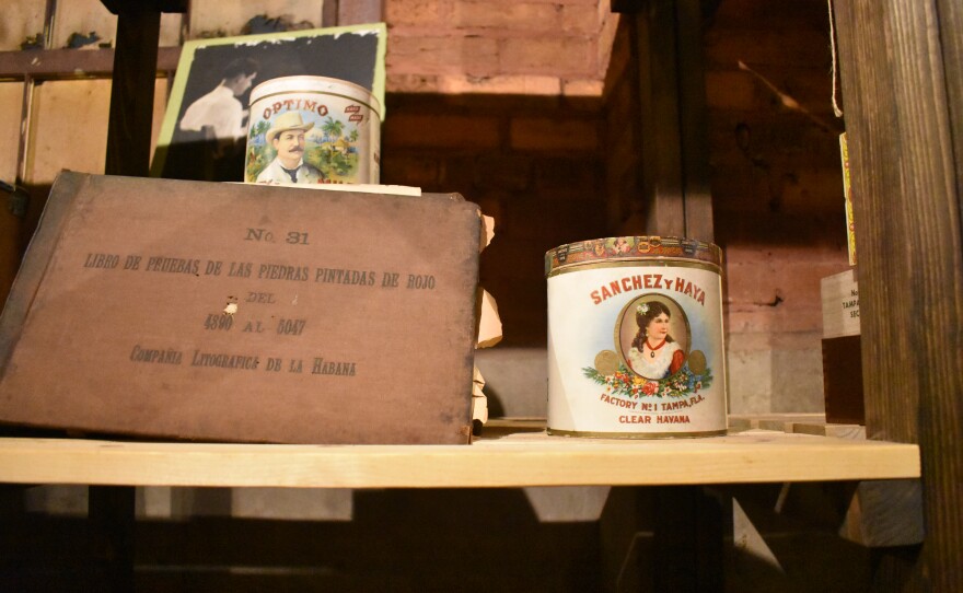 An artifact that reads "Sanchez y Haya" is on display in the El Reloj cigar factory.