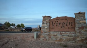 A photo of a town sign to Virgin, Utah.