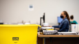 File photo of workers at the Durham County Board of Elections processing absentee ballot requests while maintaining safety during the coronavirus pandemic in Durham, N.C. on Tuesday, Aug. 18, 2020. 