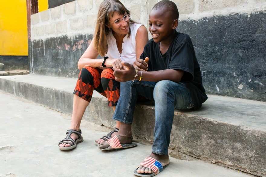 Peace Corps volunteer Anne Goreski chats with Sundaygar. Says Goreski: "He's a kid who knows how to make things happen."