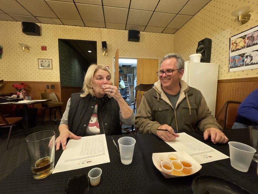 Ann Pizzoli (left) and Patrick McDevitt, both of Mt. Carmel, sample boilo at the annual contest hosted in Mt. Carmel.