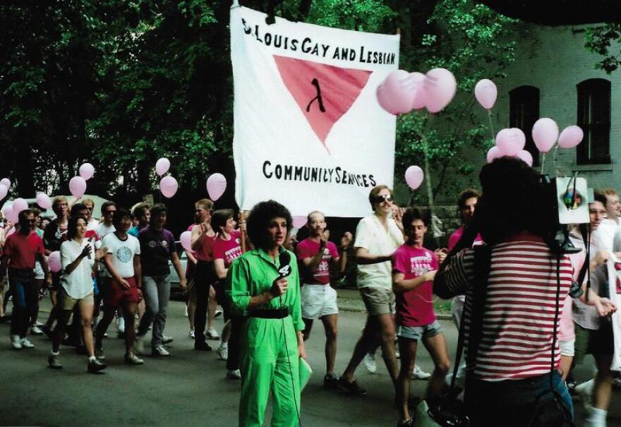  A KMOV (Channel 4) reporter records a news story from the 1984 Pride parade, where marchers carried pink balloons. It wasn't until the 1990s that the rainbow flag became a common symbol in St. Louis and nationwide.
