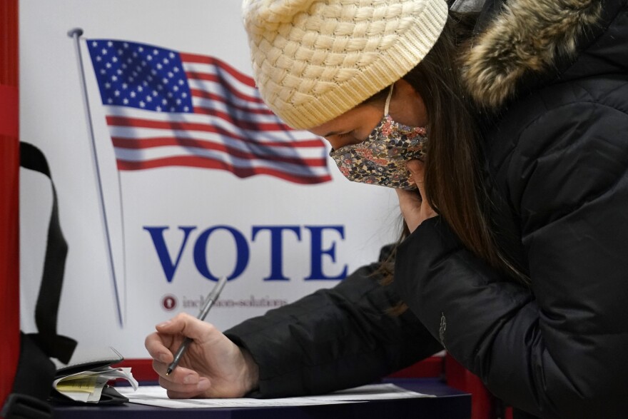 Elizabeth Gross votes on Election Day, Tuesday, Nov. 3, 2020, in Portland, Maine.