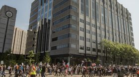 Protestors approached the outside of the Rosa Parks Federal Building in Detroit where they held a rally as part of the No Kings Day demonstration, June 14, 2025.