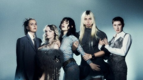 Five women posing for a photograph 