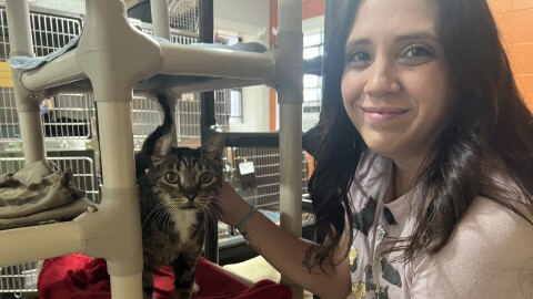 Tiffany Daniel, Vice President of Programs at the Pensacola Humane Society with 9-year-old Juanita