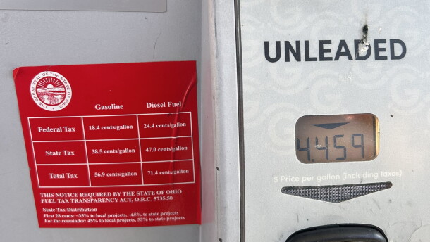 Signs on gas pumps at Giant Eagle on North High Street in Clintonville list federal and state gas taxes.