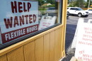 help wanted sign in a restaurant window 