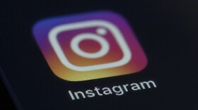The Instagram app icon on the screen of a mobile device. (Jenny Kane/AP)
