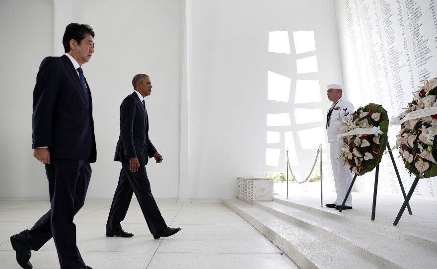 Japanese Prime Minister Shinzo Abe and President Barack Obama participate in a wreath laying ceremony at the USS Arizona Memorial, part of the World War II Valor in the Pacific National Monument, in Joint Base Pearl Harbor-Hickam, Hawaiʻi, adjacent to Honolulu, Hawaiʻi, Tuesday, Dec. 27, 2016, as part of a ceremony to honor those killed in the Japanese attack on the naval harbor. (AP Photo/Carolyn Kaster)